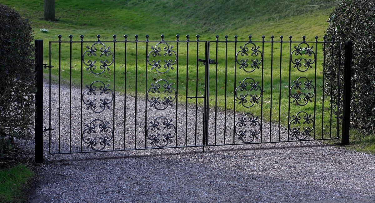 Double metal driveway gates fitted to front entrance of home