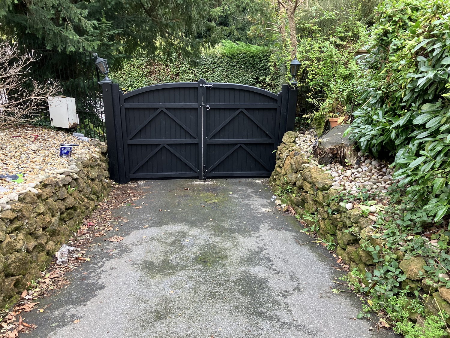 Rear face of Kent Wooden Estate Gates mounted onto wooden posts all painted black